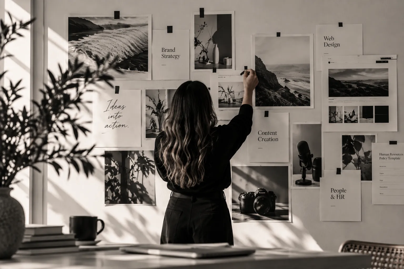 Strive creative pinning service notes — Brand Strategy, Web Design, Content Creation, People & HR — on a sunlit studio moodboard wall